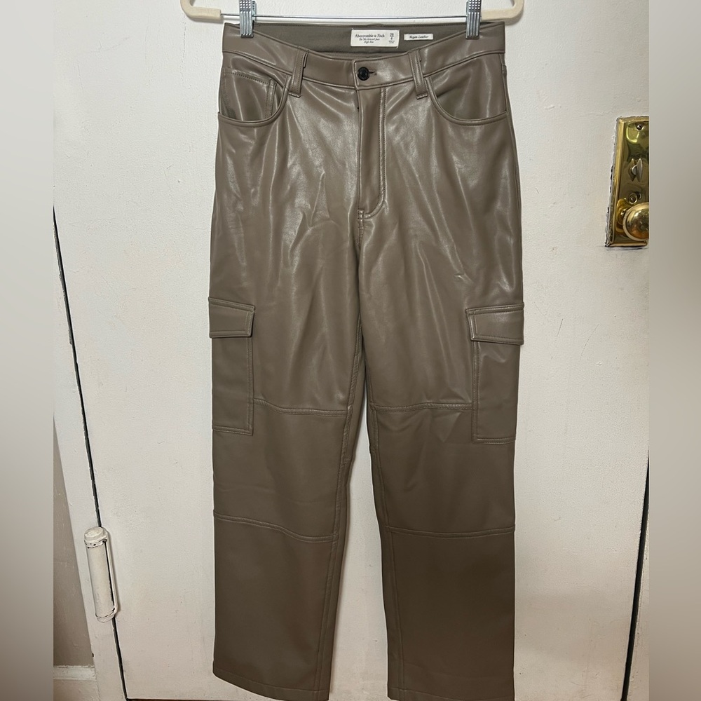 Faux leather cargo pants in taupe. Stretchy